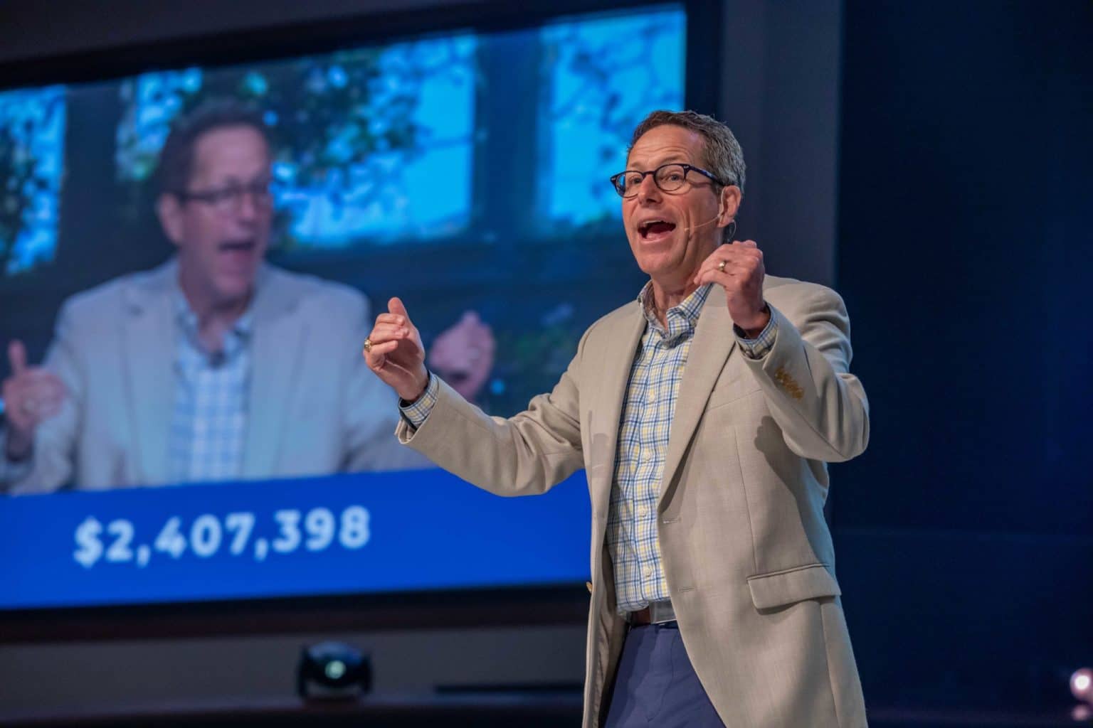 Gregg Matte, senior pastor of Houston’s First Baptist Church, celebrates the record World Mission Offering on Easter Sunday, April 4. The total in the background grew by $220,000 over the following days. (Photo by Richard Carson, courtesy of HFBC)