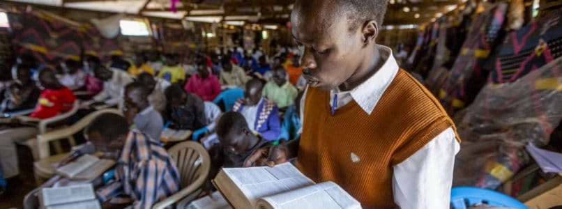 A refugee and Bible school student reads Scripture aloud in class at Liberty Baptist Church in Bidibidi Refugee Settlement in northwestern Uganda. (IMB)