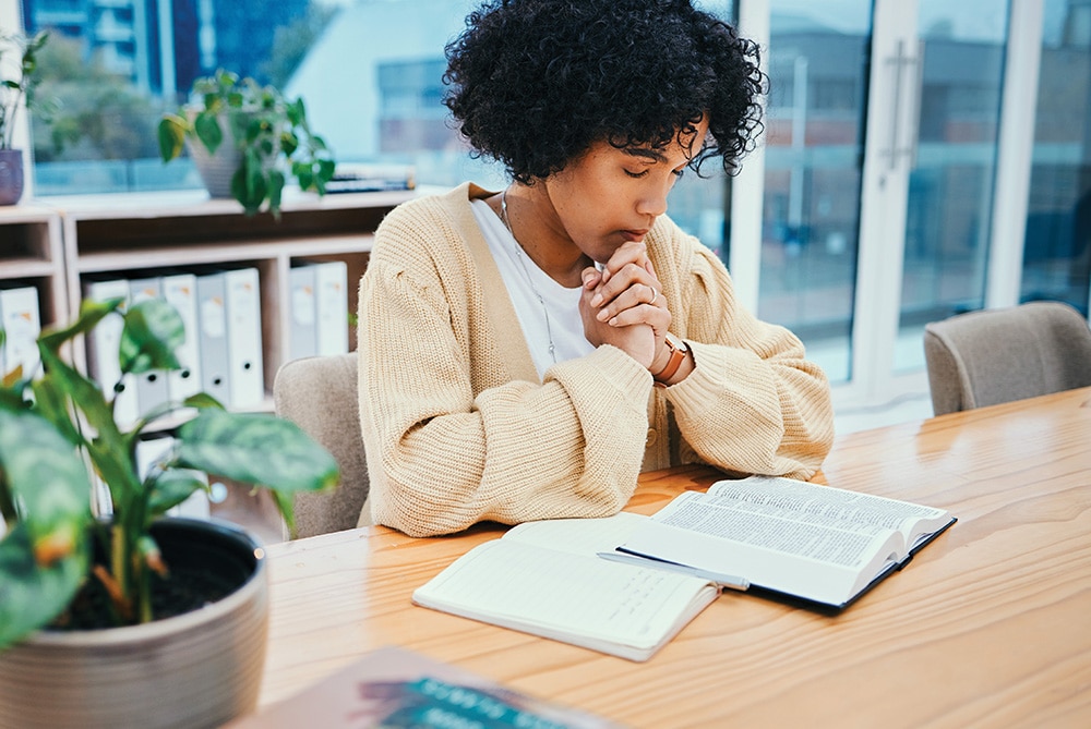 praying woman Bible